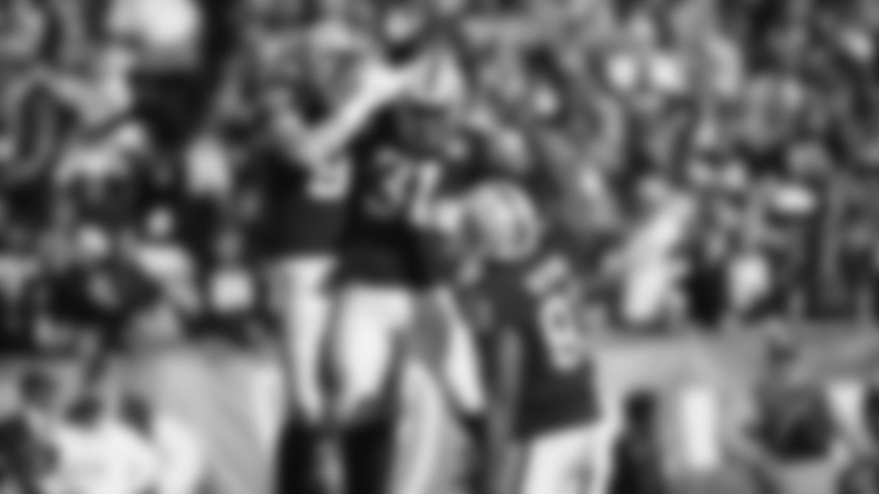 Raiders defensive end Maxx Crosby (98), cornerback Isaiah Johnson (31) and defensive end Benson Mayowa (91) celebrate during the regular season game against the Jacksonville Jaguars.