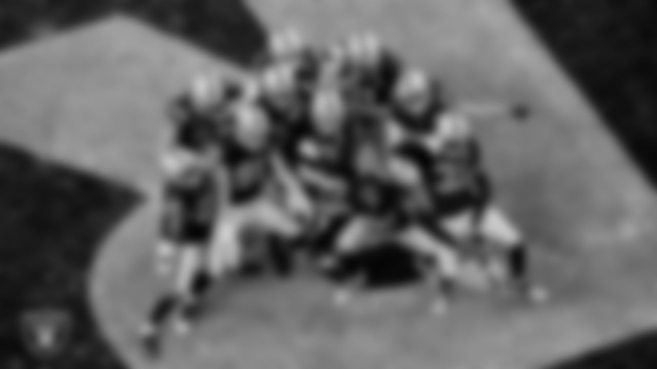 The Las Vegas Raiders celebrate after an interception during the regular season game against the Denver Broncos at Allegiant Stadium.