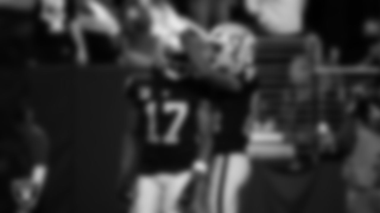 Las Vegas Raiders wide receiver Davante Adams (17) celebrates with wide receiver Keelan Cole (84) after making a 48-yard touchdown catch during the regular season home game against the Indianapolis Colts at Allegiant Stadium.