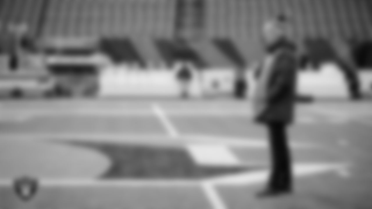 General Manager Mike Mayock warming up before the postseason away game against the Cincinnati Bengals.