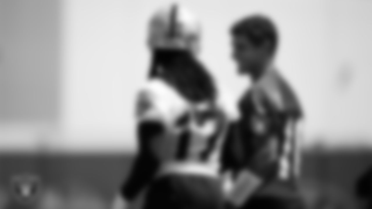 Las Vegas Raiders wide receiver Davante Adams (17) and quarterback Jimmy Garoppolo (10) on the field for practice at 2023 Training Camp at Intermountain Health Performance Center.