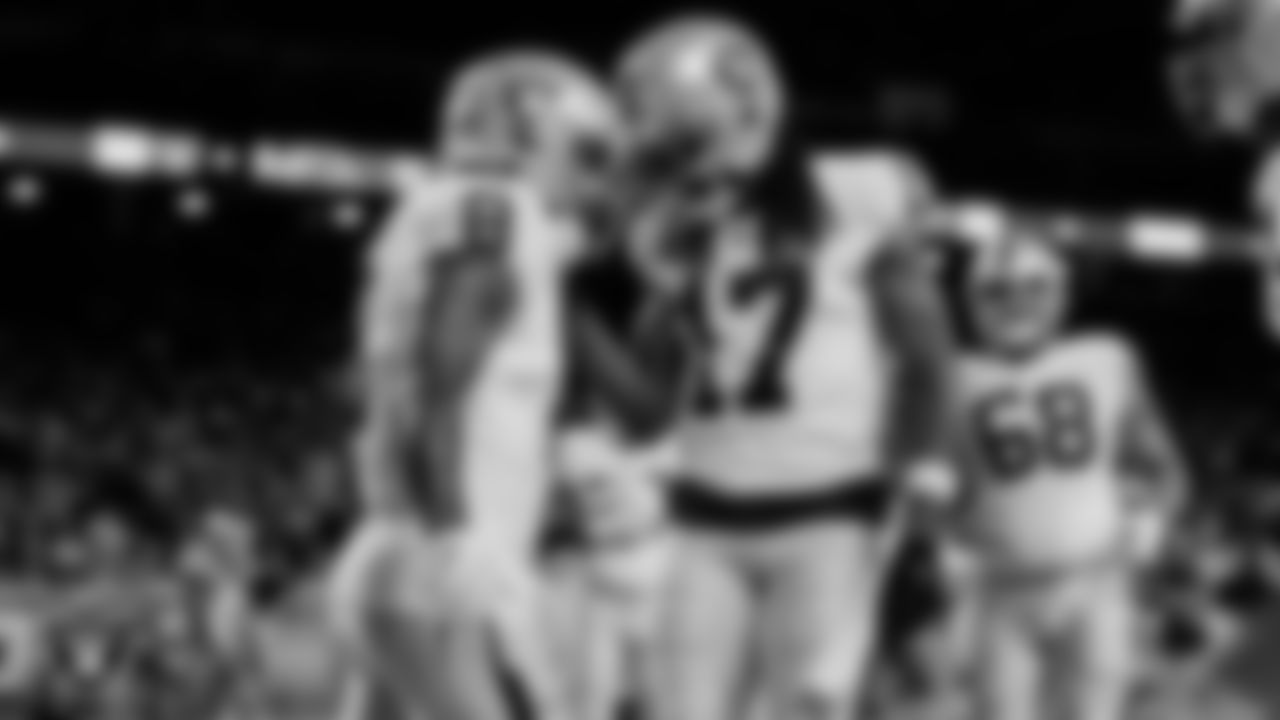 Las Vegas Raiders running back Josh Jacobs (8) celebrates with wide receiver Davante Adams (17) after rushing for a 3-yard touchdown during the regular season away game against the Detroit Lions at Ford Field.
