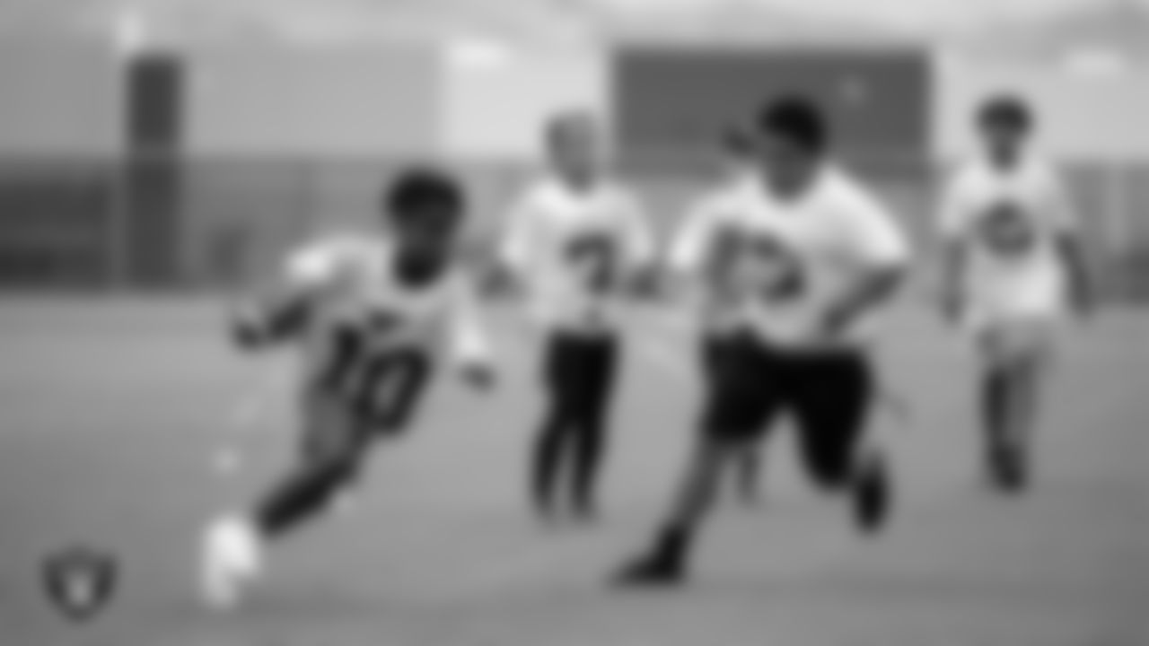 Athletes participate in a flag football game during C.H.A.M.P. Camp at Intermountain Health Performance Center.