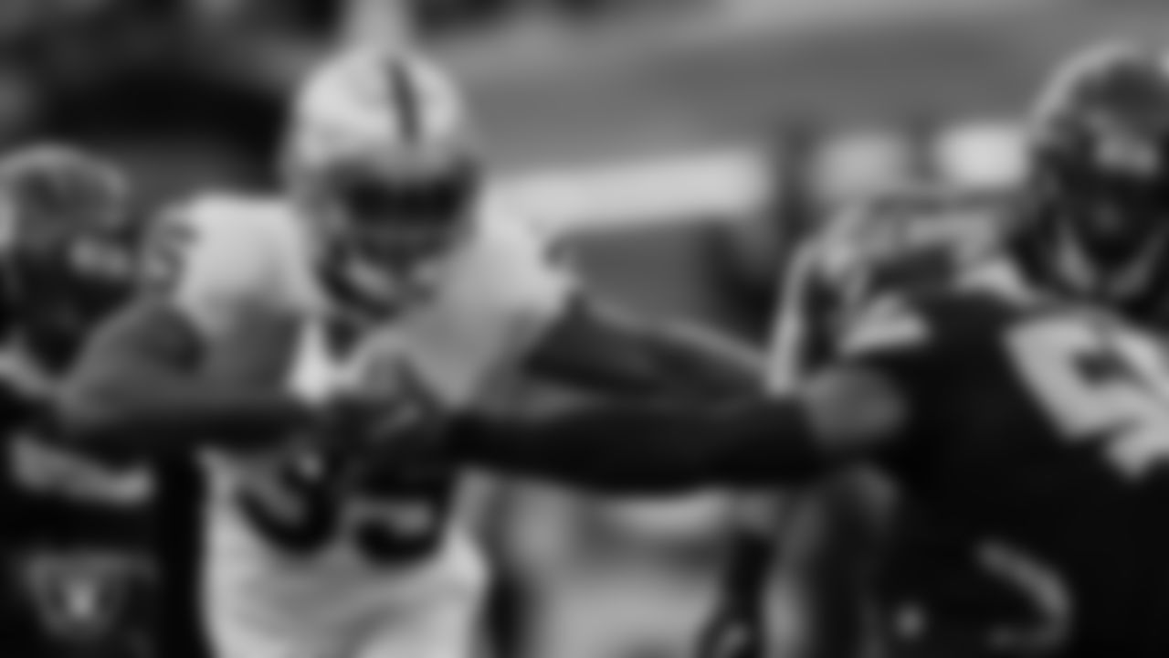 Las Vegas Raiders running back Zamir White (35) stiff arms the defender during the regular season away game against the Seattle Seahawks at Lumen Field.