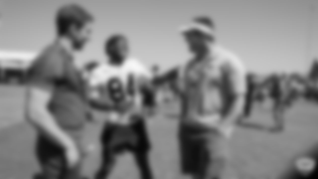 Oakland Raiders wide receiver Antonio Brown (84) and alumnus Bill Romanowski on the field for practice at 2019 Training Camp.
