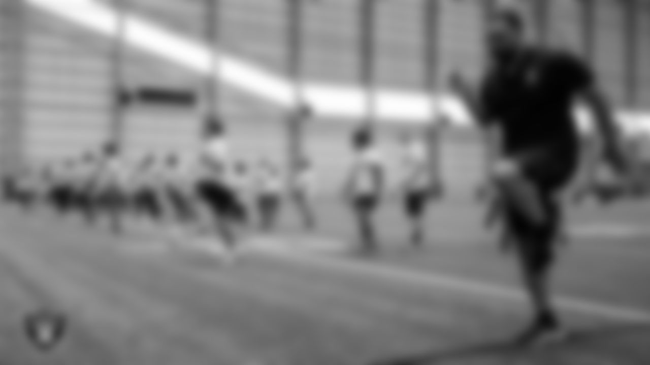 Las Vegas Raiders alumni Teyo Johnson goes through drills with athletes during the ELITE Academy at Las Vegas Raiders Headquarters.