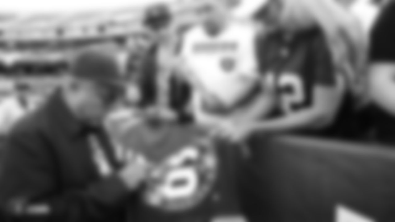 Raiders fan and comedian George Lopez signs autographs for fans before the Raiders regular season game against the Denver Broncos.