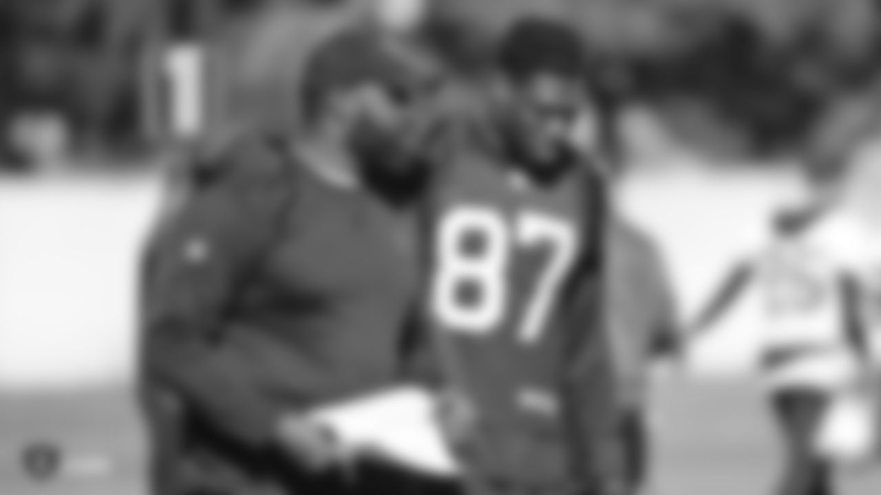 Oakland Raiders assistant offensive line coach Lemuel Jeanpierre and tight end Jared Cook (87) on the field for practice at the Oakland Raiders Practice Facility, Friday, November 30, 2018, in Alameda, California.