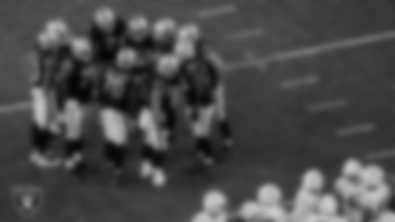 The Las Vegas Raiders offense huddles during the regular season home game against the Los Angeles Chargers.