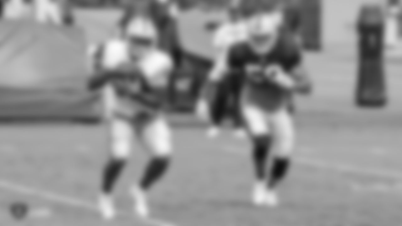 Oakland Raiders running back Jalen Richard (30) and linebacker Kyle Wilber (58) on the field for a preseason practice at The Oakland Raiders Practice Facility, Tuesday, August 28, 2018, in Alameda, California.