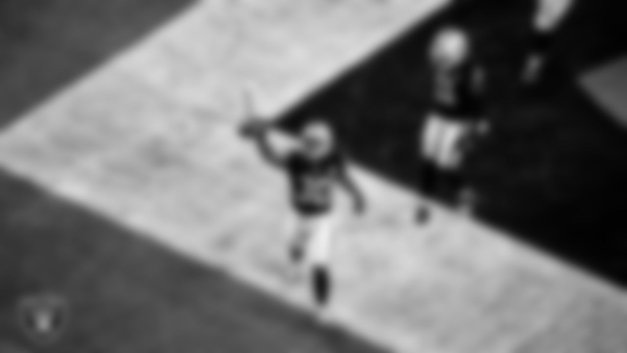 Las Vegas Raiders running back Jalen Richard (30) celebrates after rushing for a 20-yard touchdown during the regular season home game against the New Orleans Saints.