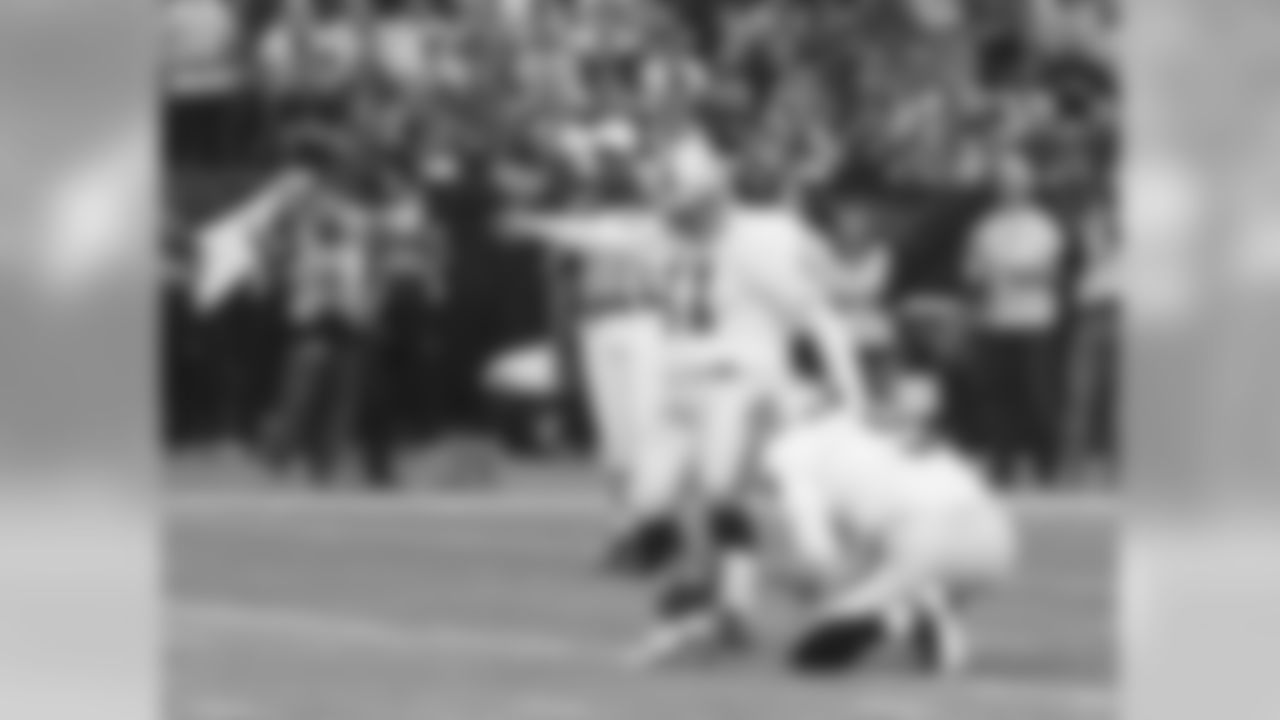 K Sebastian Janikowski kicks an extra point.