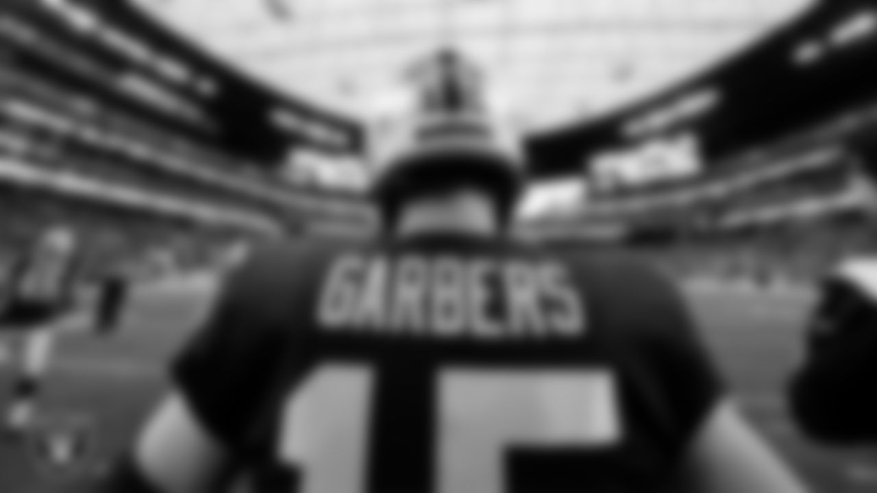 Las Vegas Raiders quarterback Chase Garbers (15) warming up before the regular season home game against the San Francisco 49ers at Allegiant Stadium.