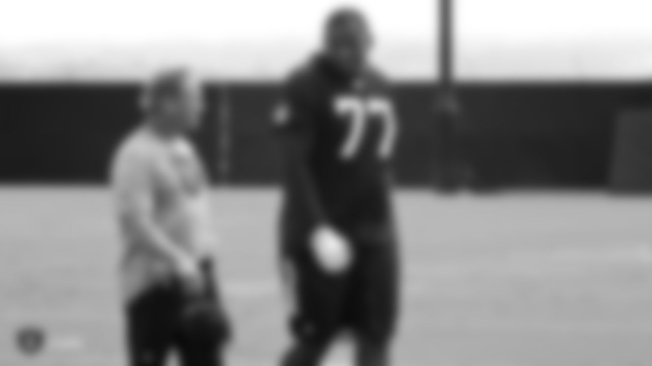 Raiders Head Coach Jon Gruden and tackle Trent Brown (77) on the field for practice.