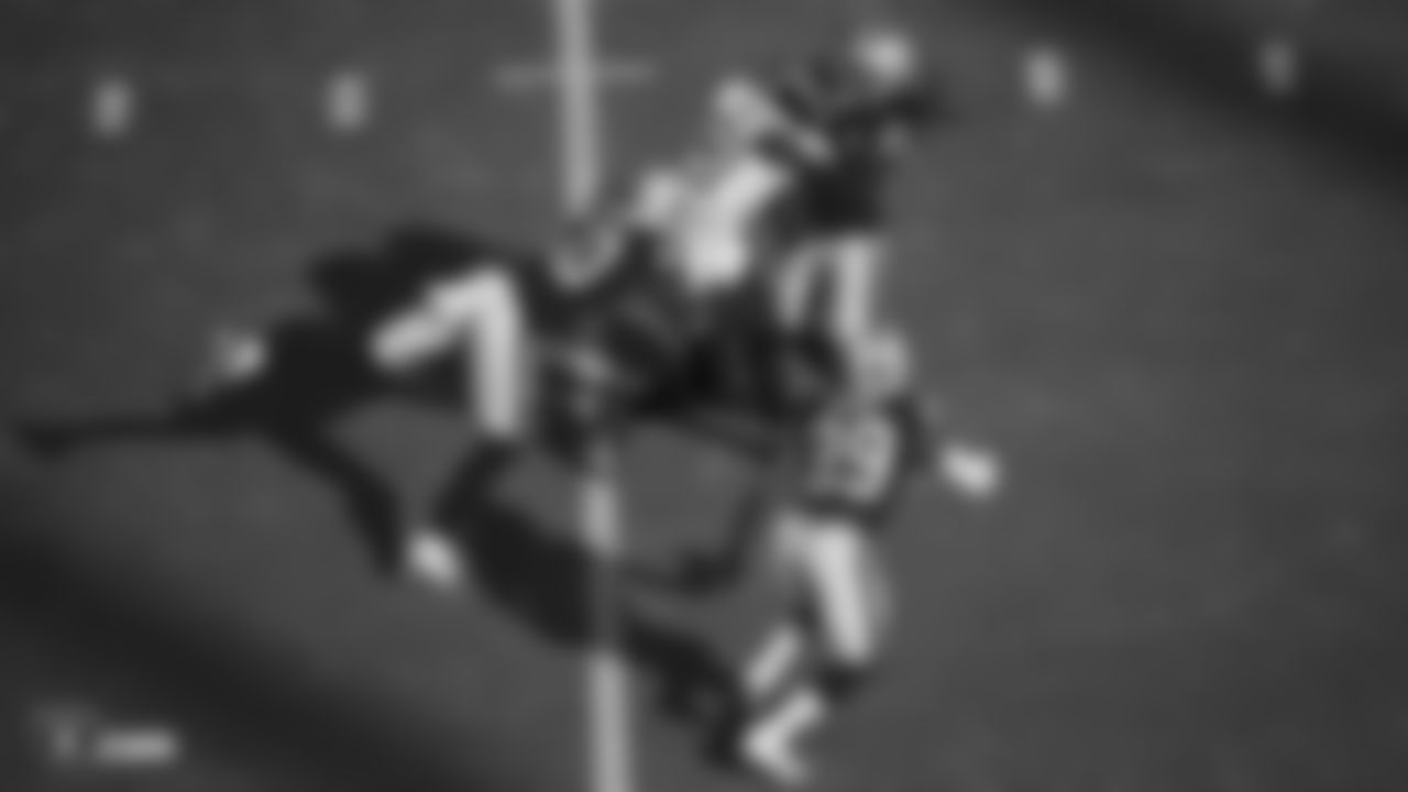 Raiders linebacker Nicholas Morrow (50) and safety D.J. Swearinger (21) make a tackle during the regular season game against the Tennessee Titans.