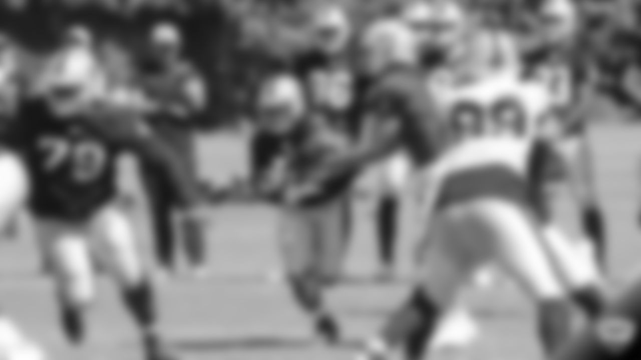 Raiders running back DeAndré Washington (33) and quarterback Nathan Peterman (3) on the field for practice at 2019 Training Camp.
