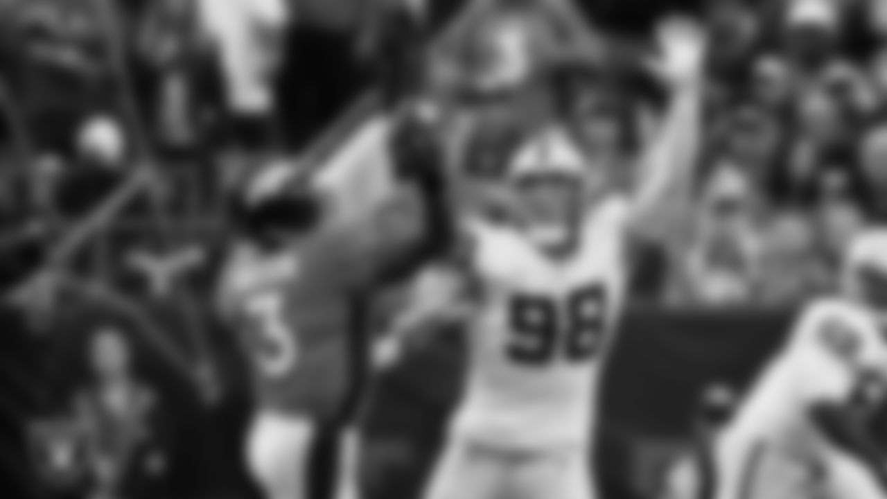 Las Vegas Raiders defensive end Maxx Crosby (98) pressures the quarterback during the regular season away game against the Denver Broncos at Empower Field at Mile High.