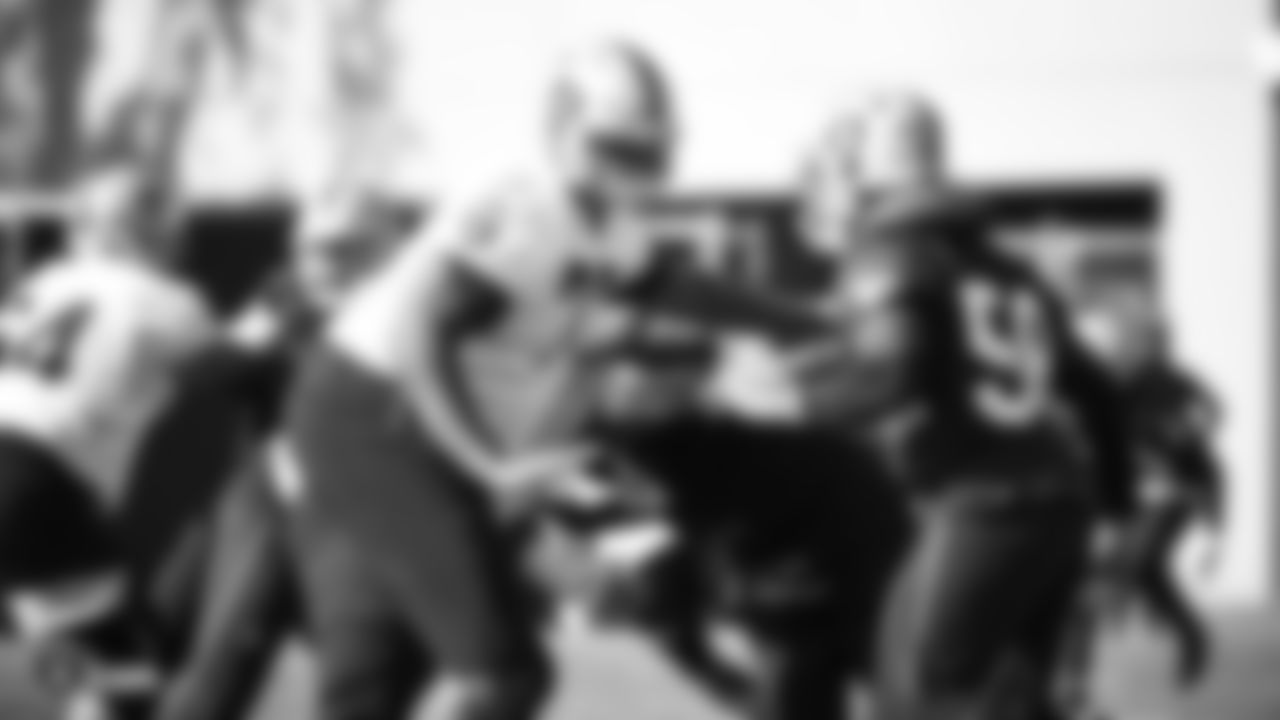 Raiders tackle Trent Brown (77) blocks linebacker Kyle Wilber (58) during practice.