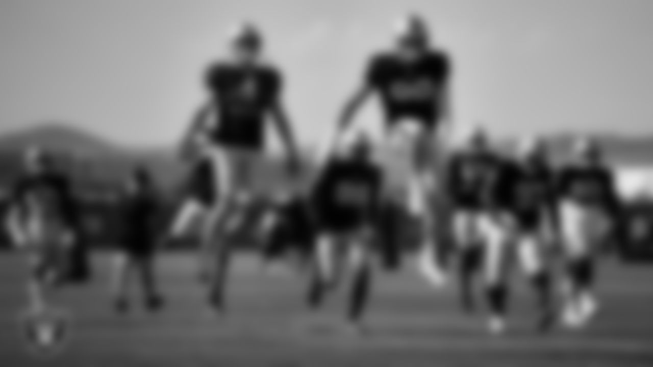 Las Vegas Raiders quarterback Derek Carr (4) and defensive end Maxx Crosby (98) on the field for a joint practice with the New England Patriots at 2022 Training Camp at Intermountain Healthcare Performance Center.