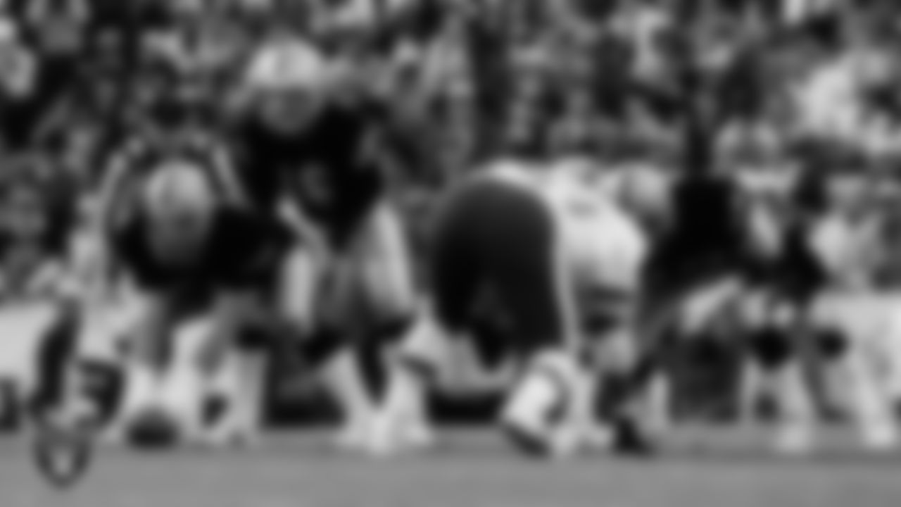 Raiders center/guard Dave Dalby (50) and quarterback Jim Plunkett (16) line up before the snap during Super Bowl XVIII against the Washington Football Team at Tampa Stadium, Sunday, January 22, 1984, in Tampa, Fla. The Raiders won 38-9.