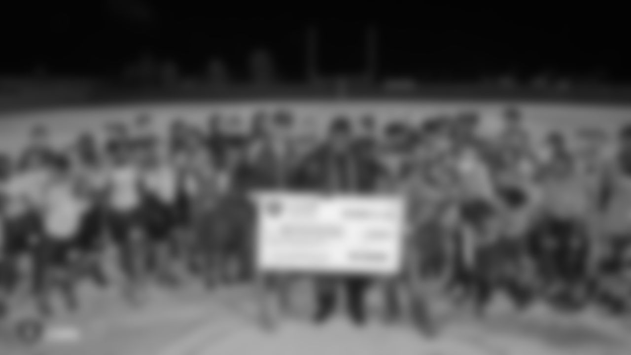 The Clark County District Flag Football league, a collaboration between the Raiders and Clark County School District, is presented with a $20,000 donation from the Raiders, represented by Leo Gray, for new equipment, transportation, officials, and recruiting, Thursday, November 15, 2018, in Las Vegas, Nevada.