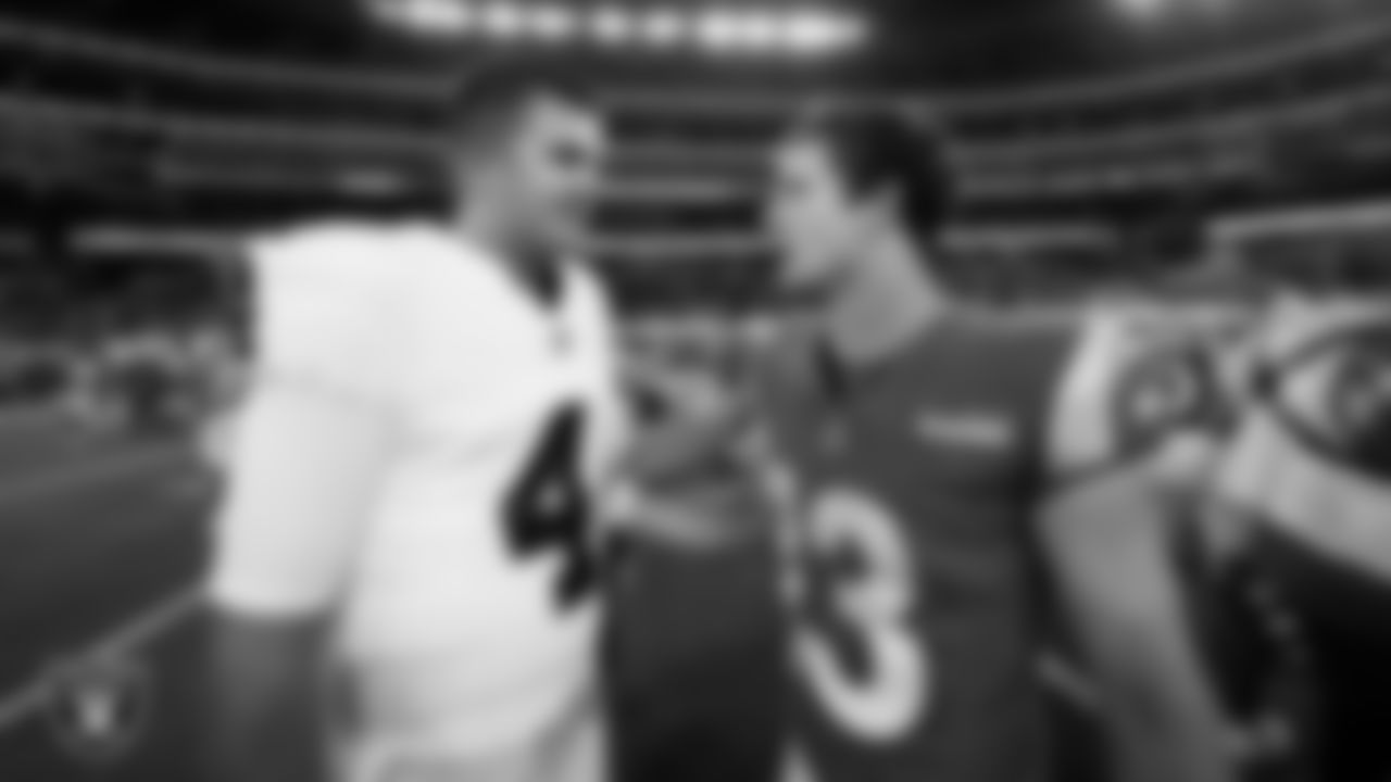 Las Vegas Raiders quarterback Aidan O'Connell (4) with Los Angeles Rams quarterback Stetson Bennett (13) after the preseason away game at Sofi Stadium.