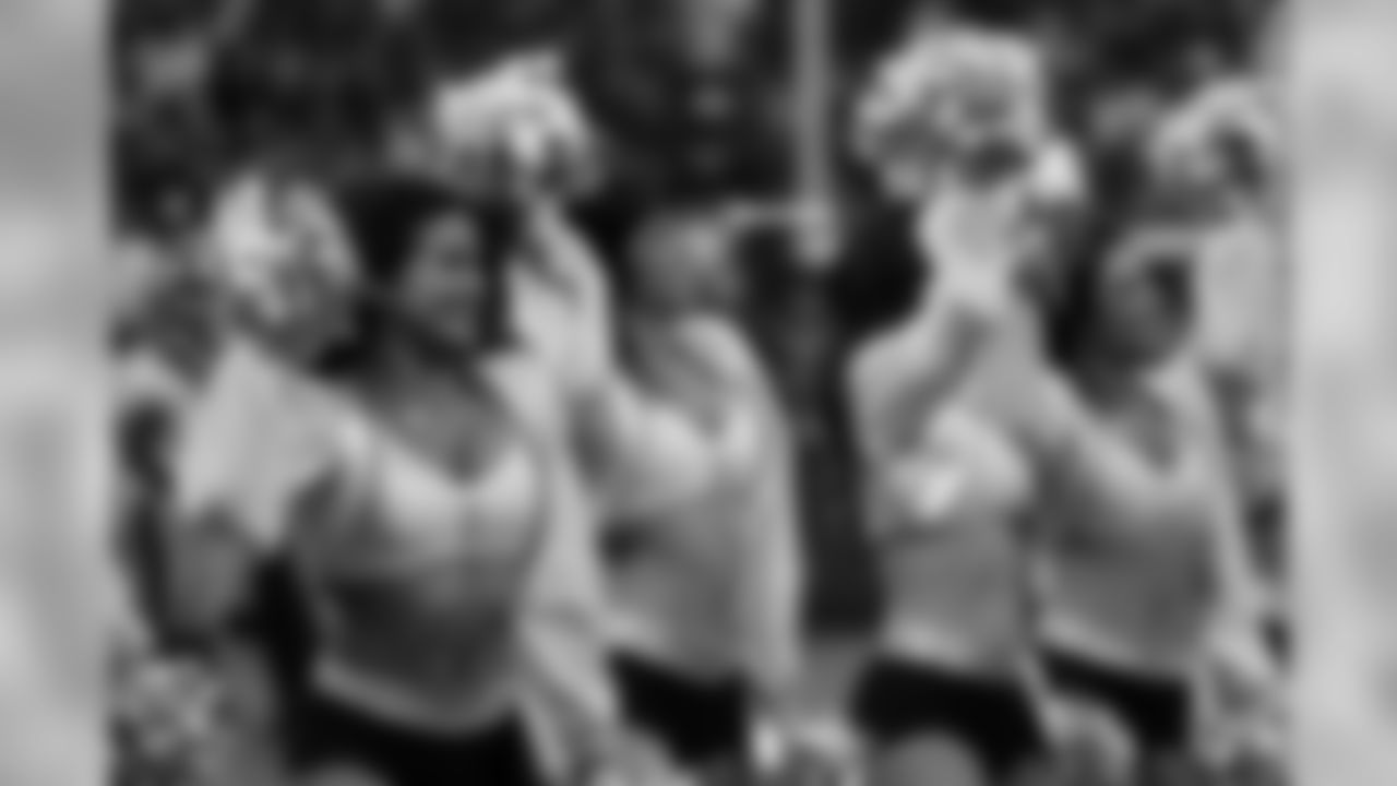 The Raiderettes perform on the sideline for the fans during the Raiders victory.