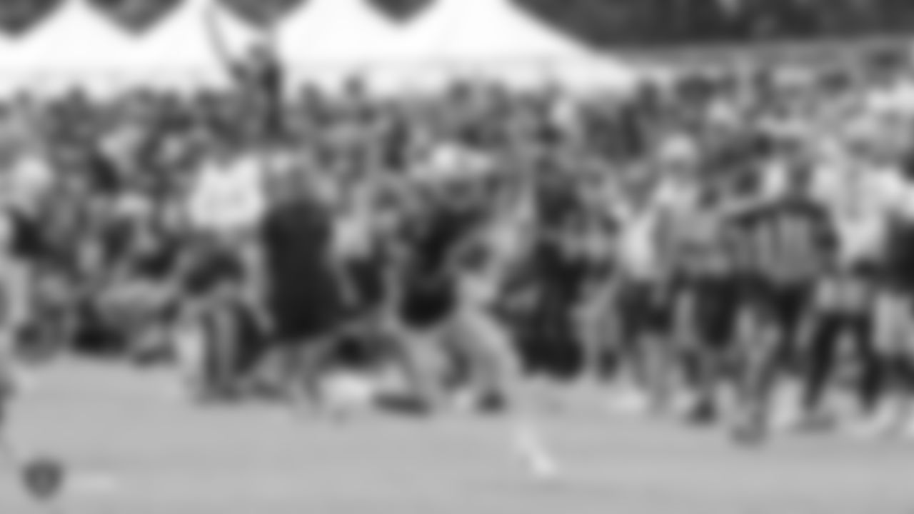Oakland Raiders wide receiver Martavis Bryant (12) with aDetroit Lions player on the field for practice at 2018 Training Camp at The Oakland Raiders Napa Valley Training Complex, Wednesday, August 8, 2018, in Napa, California.