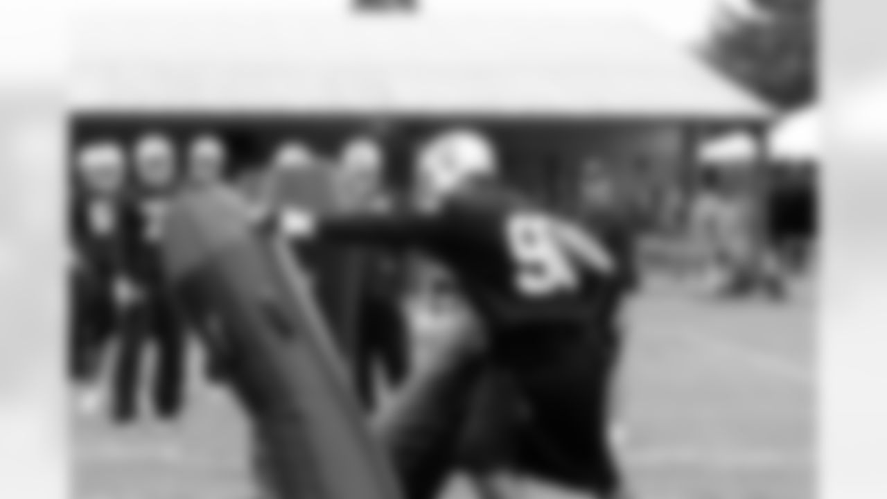 Defensive linemen get after the tackling dummies. Photo by Tony Gonzales.