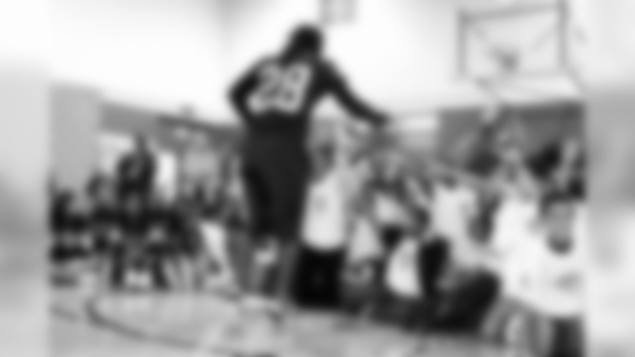 DB Joe Porter greets the excited students as he enters the gym. Photo by Tony Gonzales.