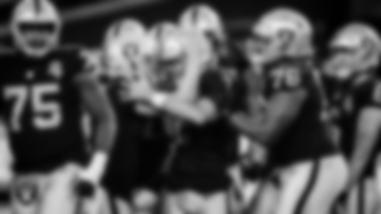 Las Vegas Raiders kicker Daniel Carlson (2) is congratulated by quarterback Derek Carr (4) and guard John Simpson (76) after kicking a 54-yard field goal during the regular season home game against the New Orleans Saints.