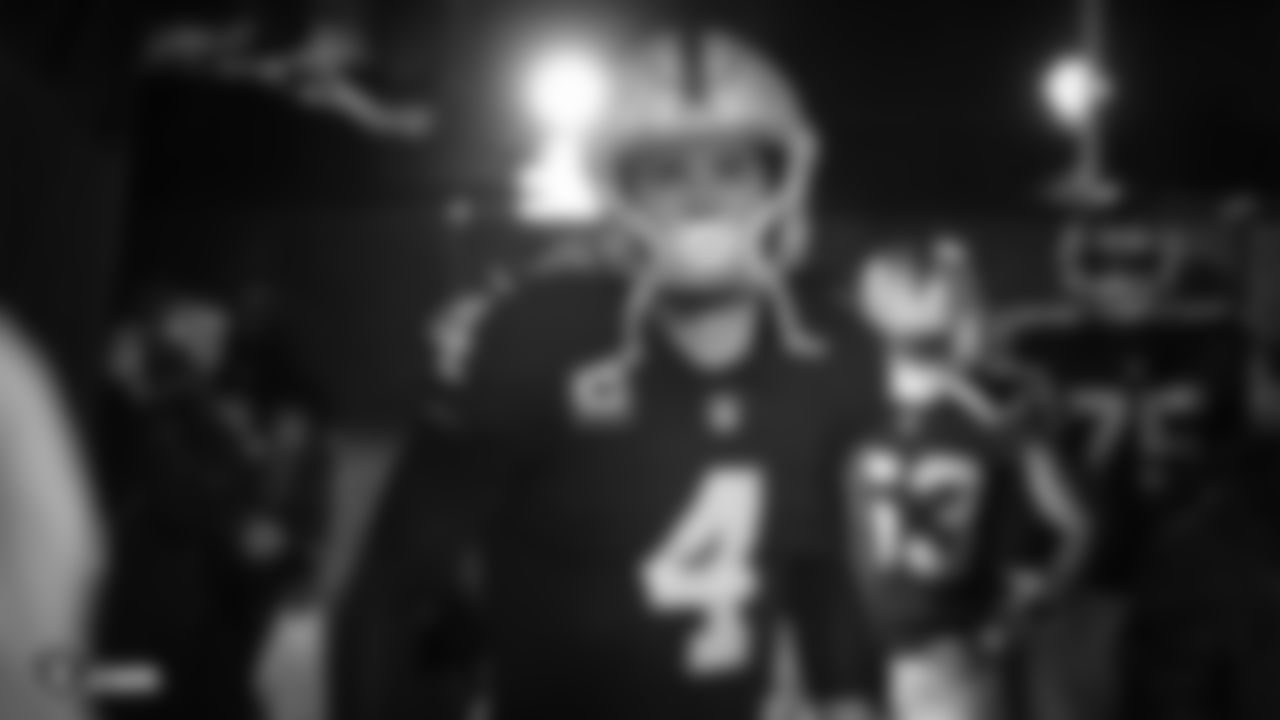 Oakland Raiders quarterback Derek Carr (4) waits to be introduced onto the field before the Oakland Raiders regular season game against the Denver Broncos at Oakland-Alameda County Coliseum, Monday, December 24, 2018, in Oakland, California. The Oakland Raiders won 24-17.