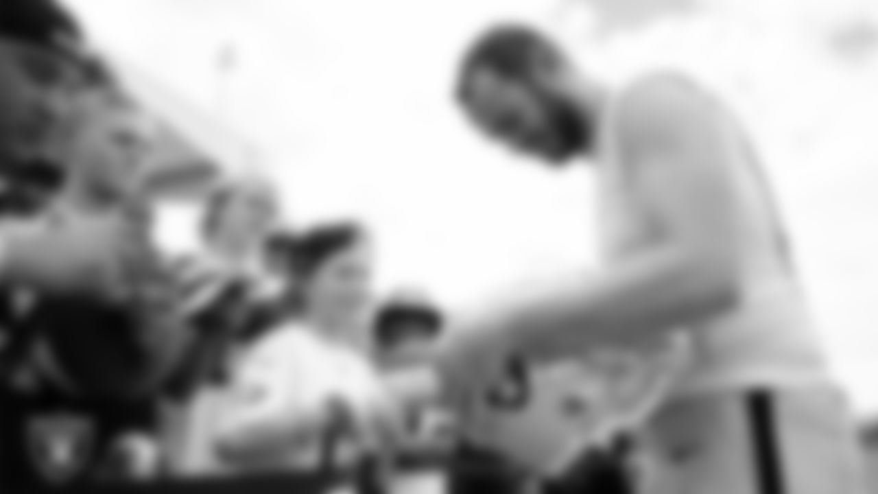 Las Vegas Raiders wide receiver Hunter Renfrow (13) signs autographs for fans after practice at 2023 Training Camp at Intermountain Health Performance Center.