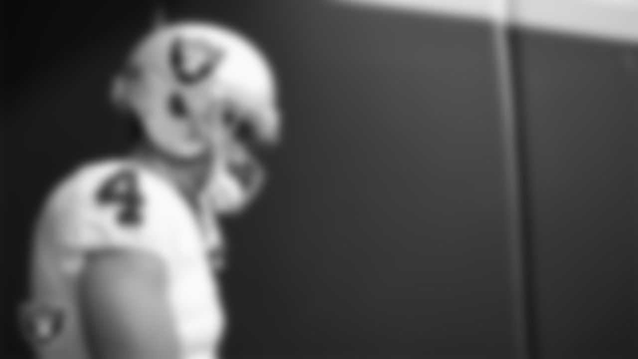Las Vegas Raiders quarterback Derek Carr (4) walks down the tunnel before the regular season away game against the Kansas City Chiefs at GEHA Field at Arrowhead Stadium.