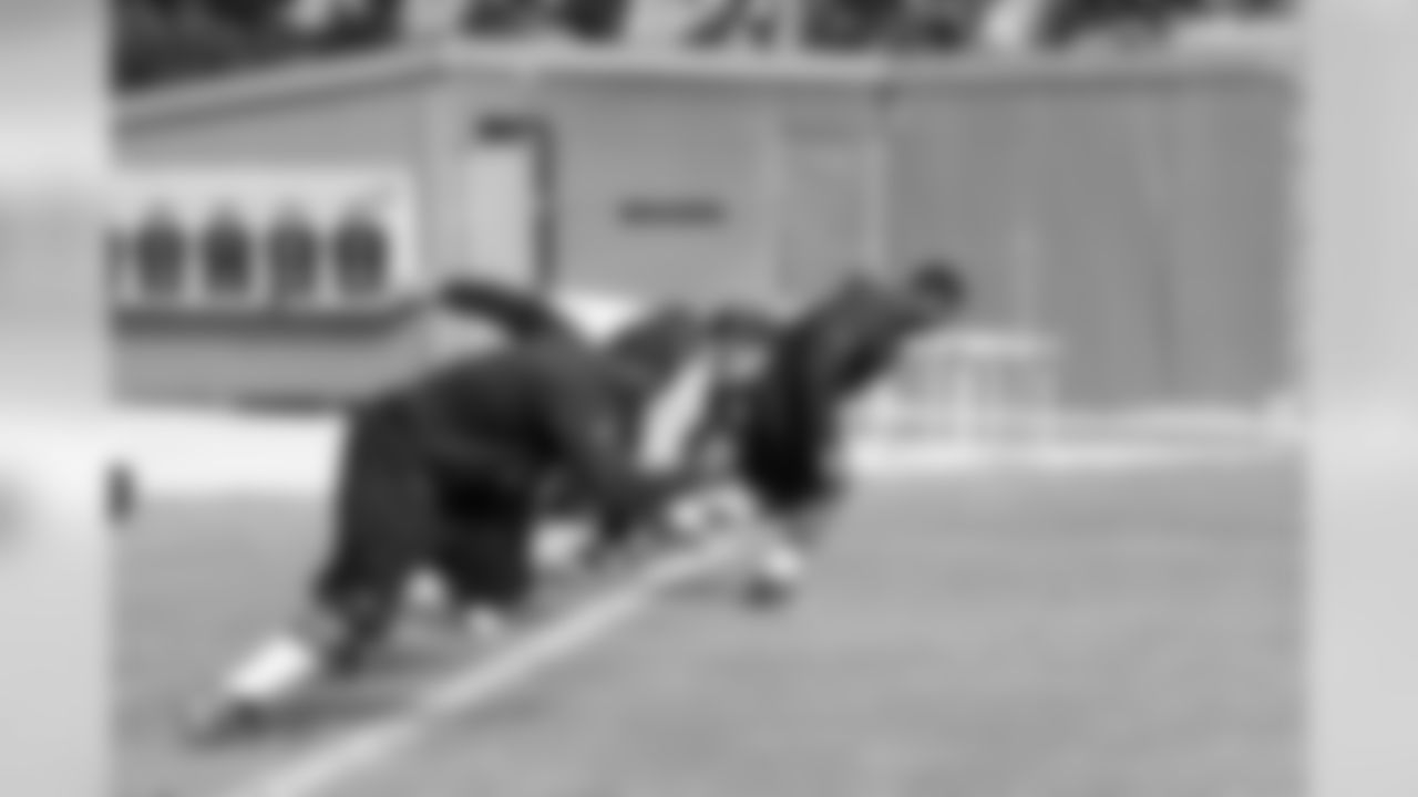 The offensive linemen get off the line.