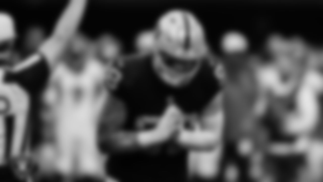 Las Vegas Raiders defensive end Maxx Crosby (98) celebrates after sacking the quarterback during the regular season home game against the Denver Broncos at Allegiant Stadium.