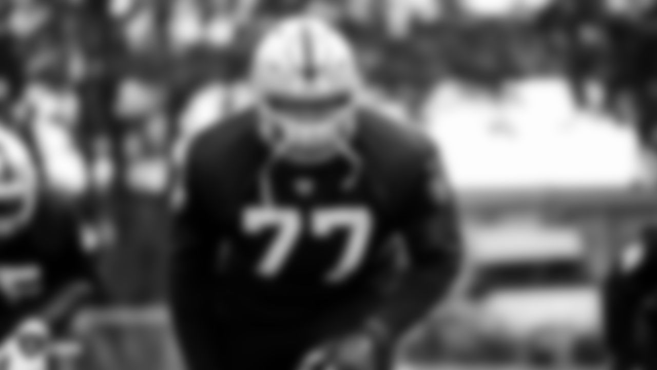 Raiders tackle Trent Brown (77) on the field for practice at The Grove Hotel.