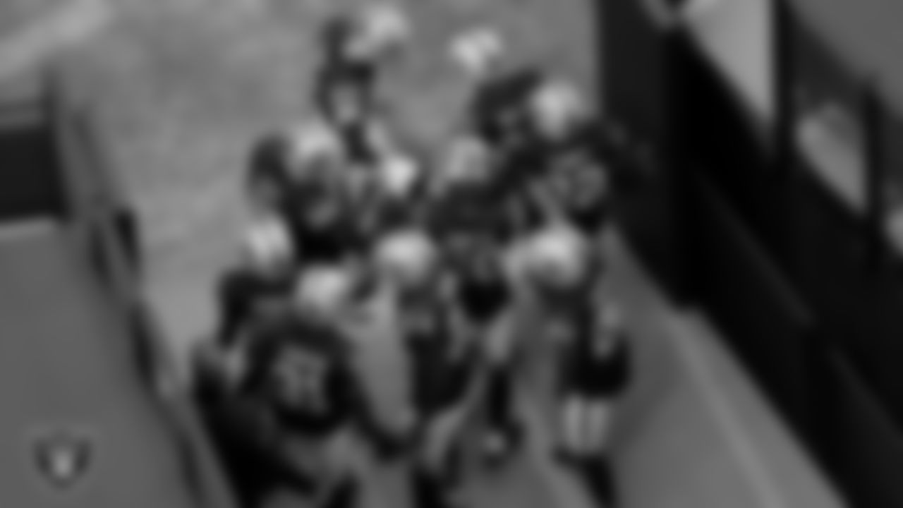 The Raiders defensive backs huddle before the regular season game against the Denver Broncos at Allegiant Stadium.