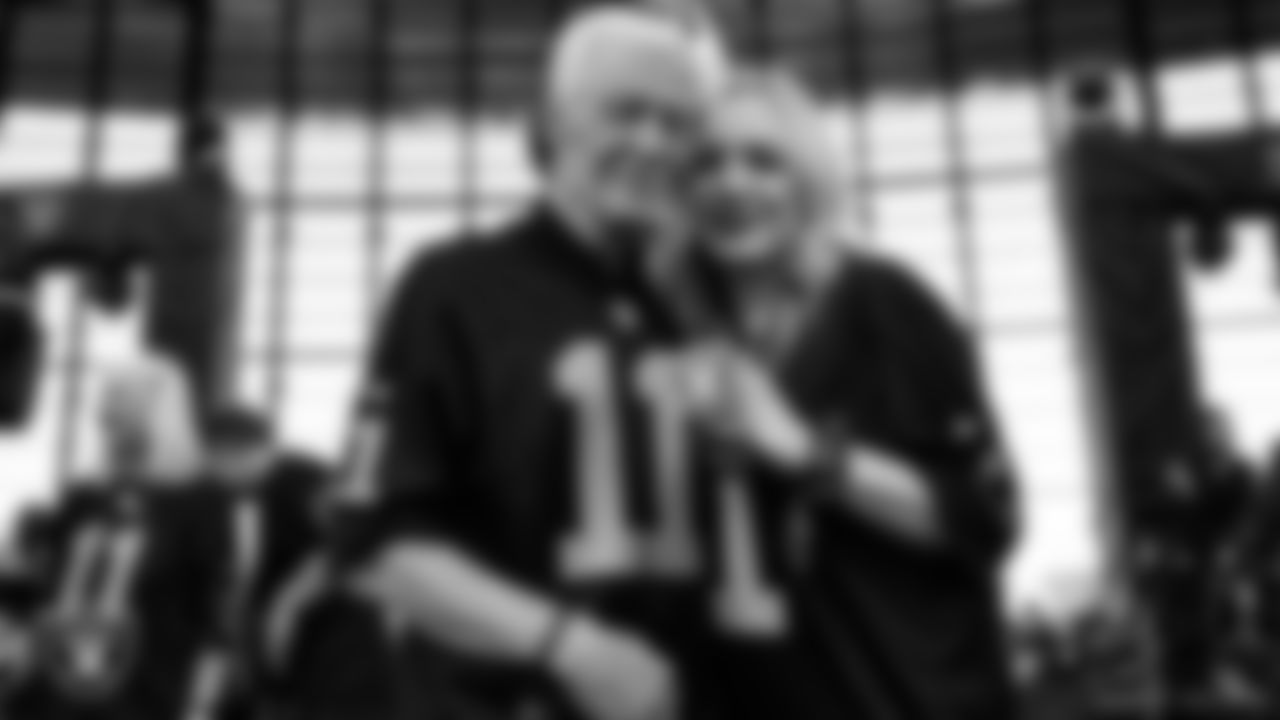 Family members of Las Vegas Raiders alumnus David Humm light the Al Davis Memorial Torch before the Las Vegas Raiders' preseason home game against the New England Patriots at Allegiant Stadium.