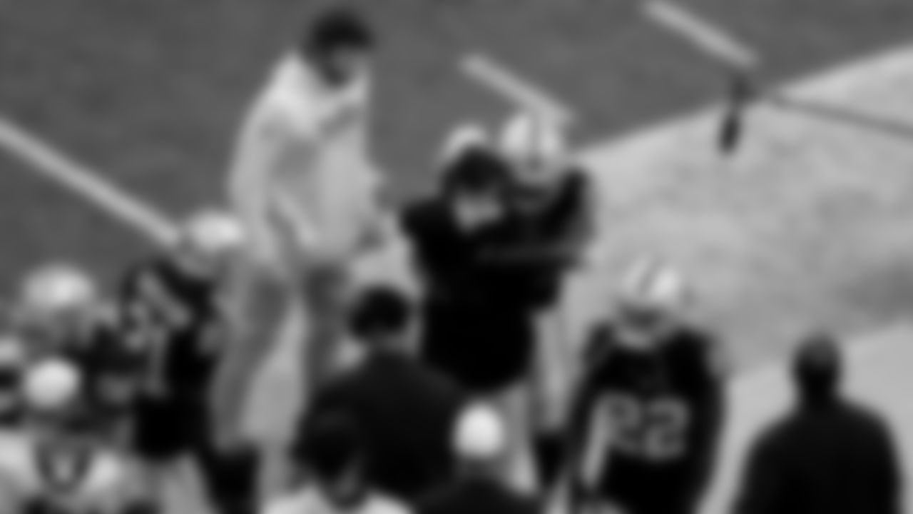 Las Vegas Raiders running back Josh Jacobs (28) hugs Head Coach Josh McDaniels after rushing for a 7-yard touchdown during the regular season home game against the Denver Broncos at Allegiant Stadium.