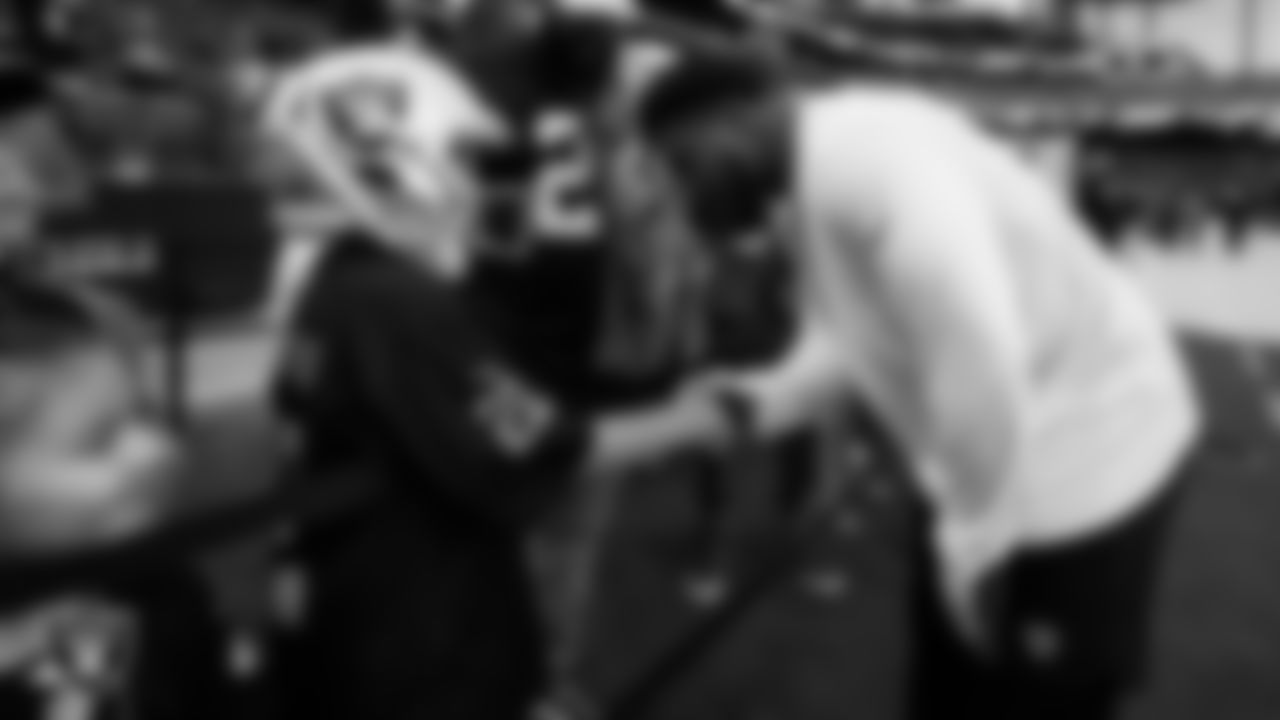 Las Vegas Raiders running back Josh Jacobs (28) with Make-A-Wish's Frankie Salvidar III before the Las Vegas Raiders' regular season home game against the Houston Texans at Allegiant Stadium.