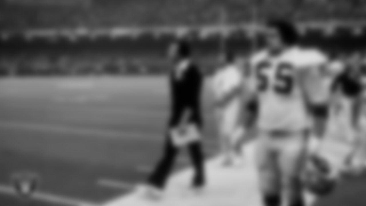 Oakland Raiders Head Coach Tom Flores and linebacker Matt Millen (55) on the sideline during Super Bowl XV against the Philadelphia Eagles.