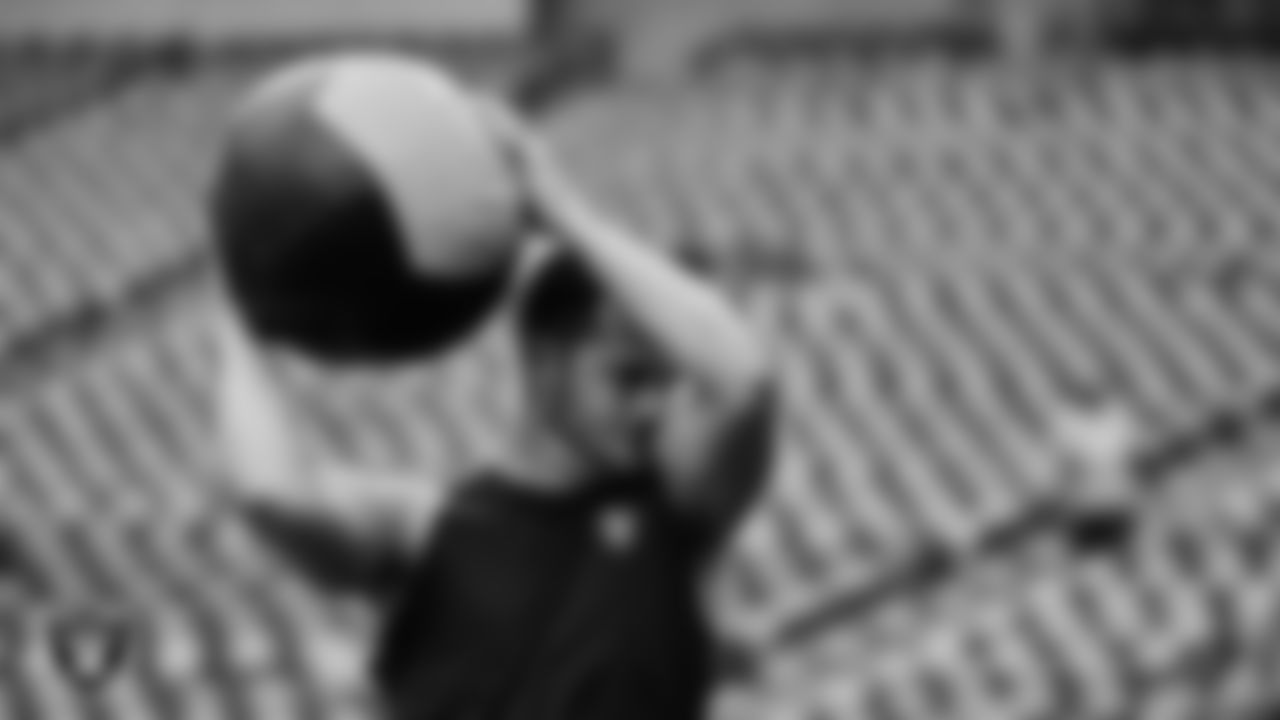 Las Vegas Raiders quarterback Derek Carr (4) warming up before the preseason home game against the New England Patriots at Allegiant Stadium.