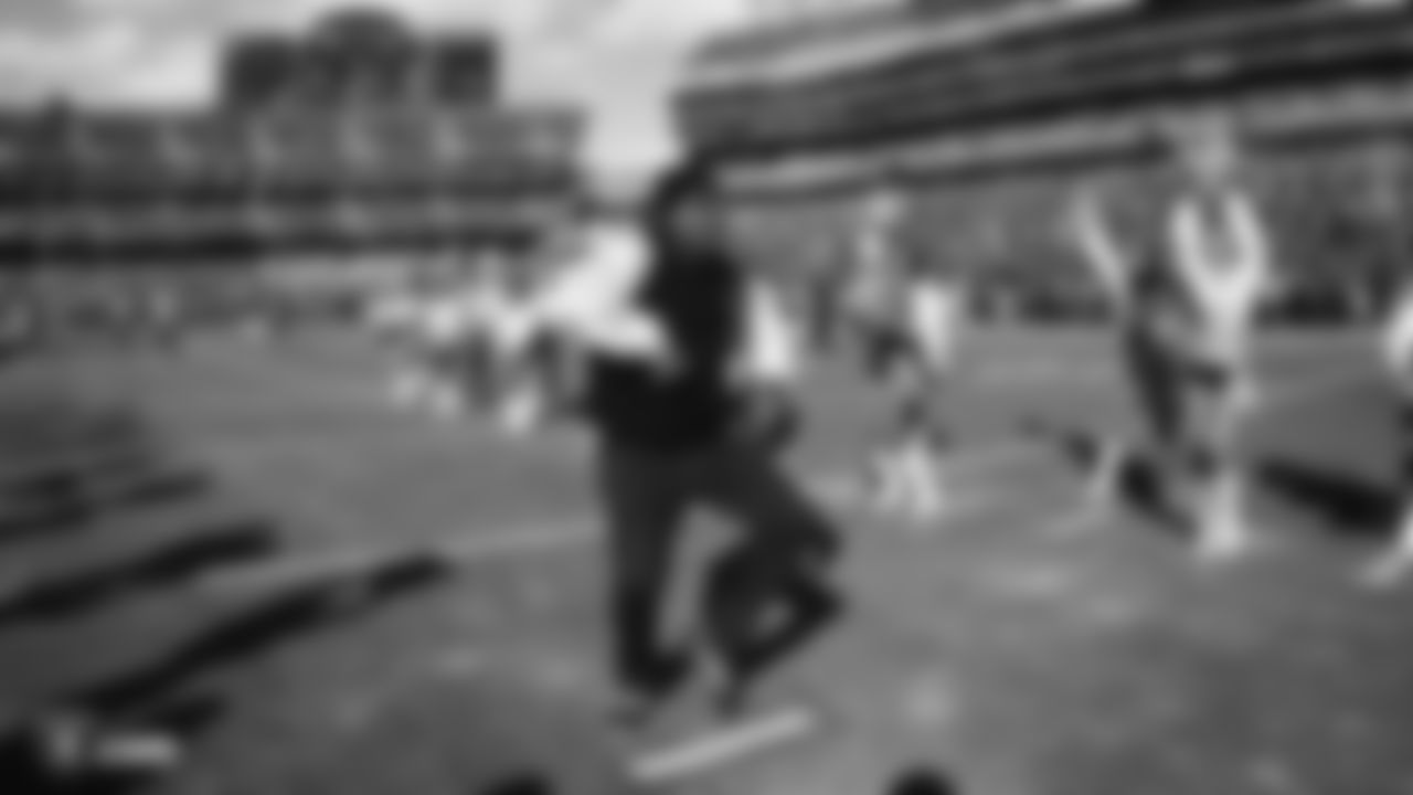 Oakland-native and rapper, MC Hammer, dances on the field before the regular season game against the Jacksonville Jaguars.