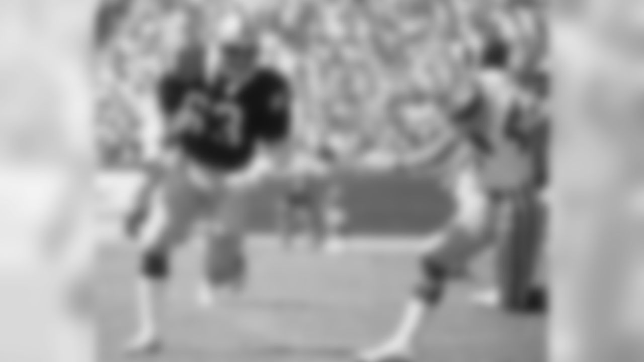 Gene Upshaw squares off against a Rams player in 1979.