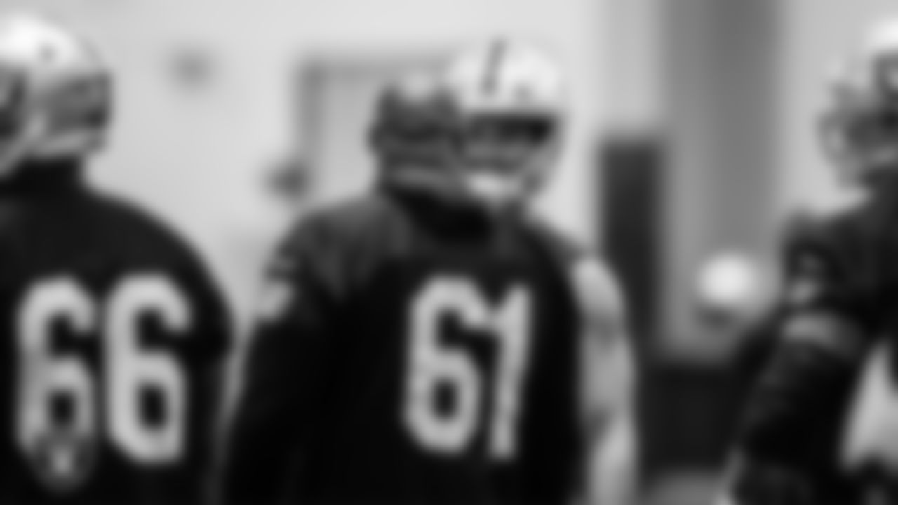 Las Vegas Raiders quarterback Derek Carr (4) and center Rodney Hudson (61) during practice.