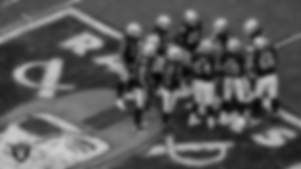 The Las Vegas Raiders offense huddles during the regular season home game against the Indianapolis Colts at Allegiant Stadium.