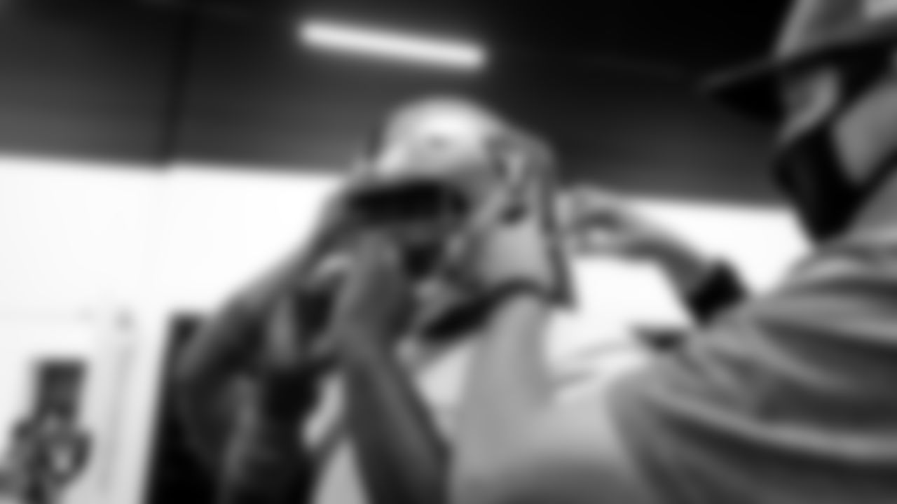 Las Vegas Raiders guard John Simpson (76) tries on his helmet after arriving for 2020 Training Camp.