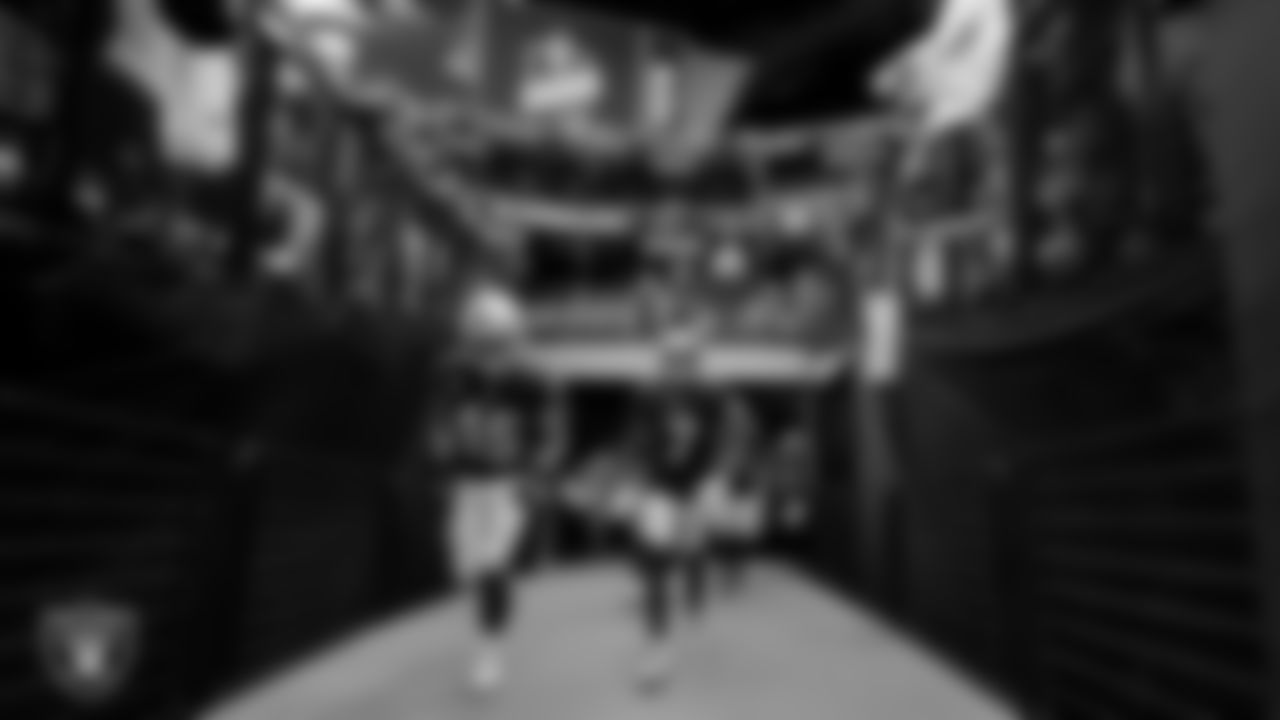 Las Vegas Raiders fullback Alec Ingold (45) and wide receiver Zay Jones (7) walk down the tunnel before the regular season home game against the Miami Dolphins .