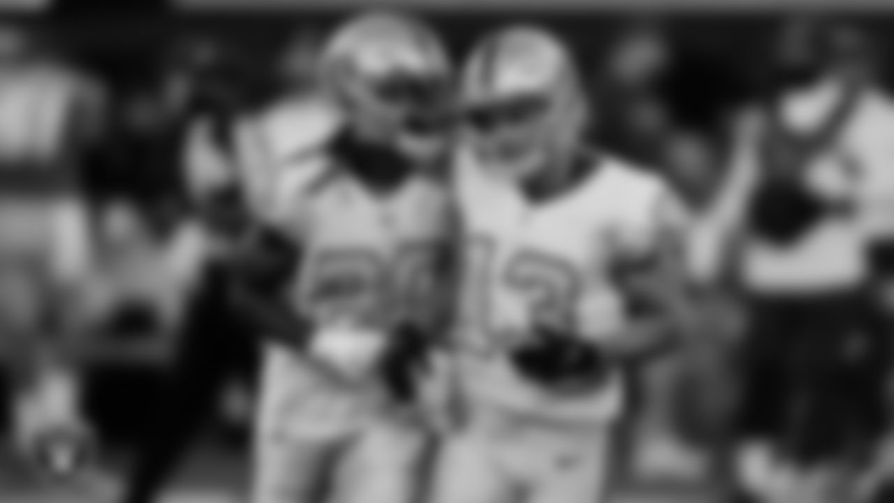 Las Vegas Raiders wide receiver Hunter Renfrow (13) is congratulated by cornerback Damon Arnette (20) after breaking up a pass during the regular season away game against the Los Angeles Chargers.